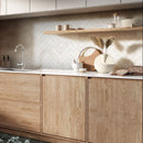 Classica white marble effect tiles laid in herringbone pattern on kitchen wall