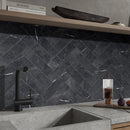 Classica black marble effect tiles laid in herringbone pattern on kitchen splashback