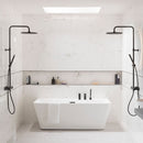 Modern bathroom with a freestanding bathtub, marble effect tiles and black fixtures.