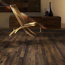 Wooden chair and sideboard on a dark wood floor