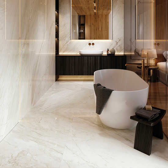 Bathroom with freestanding bath and large marble effect tiles