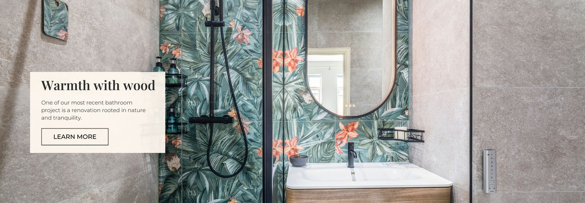 Bathroom interior with floral wallpaper, sink, and mirror.