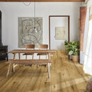 Kahrs ranch overo light wooden floor laid in planks in a small rustic dining room