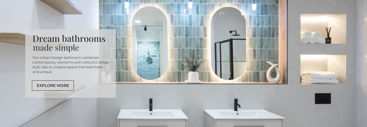 Bathroom with green zellige style wall tiles  and concrete effect tiles.
