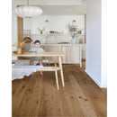 Pale scandi style kitchen with honey toned engineered wood flooring.