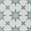 Geometric pattern tile with white and green shapes on a white background