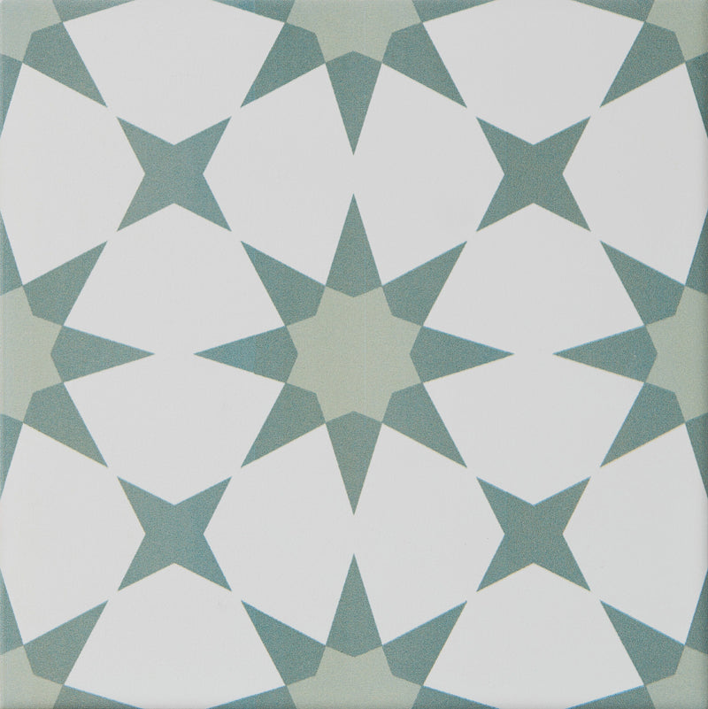 Geometric pattern tile with white and green shapes on a white background