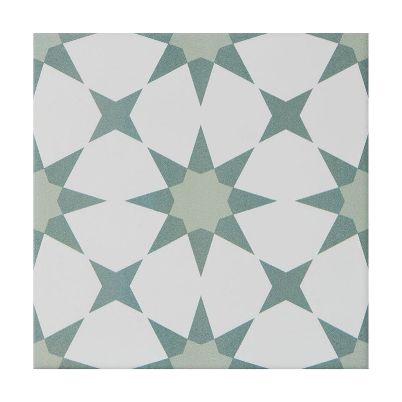 Geometric pattern tile with white and green shapes on a white background