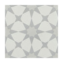 Geometric patterned tile with white and gray shapes on a white background