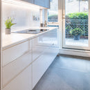 Whitr kitchen cupboards with large grey Bottega Topo 120x120 floor tiles