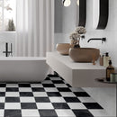 Classica black and white marble effect tiles laid in checkerboard effect on bathroom floor