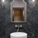 Classica black marble effect tiles laid in herringbone pattern on bathroom wall