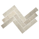 Limestone parquet arranged in a herringbone pattern on a white background