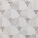 White and light gray marble fan-shaped mosaic tile pattern with small textured gray accent segments.