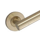 A close up of handle off a brushed brass grab rail for bathroom.