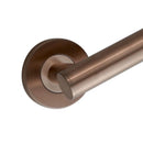 A close-up of a wall-mounted bathroom grab bar in a warm bronze finish.