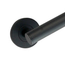 A close up of a matt black bathroom grab bar with round back plate.