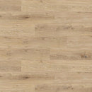 Close-up of wood effect luxury vinyl floor planks in a light brown colour and visible grain pattern.