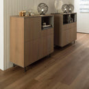 Two wooden sideboards with decorative items on a wood effect luxury vinyl floor.