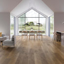 Open plan room with wood effect luxury vinyl flooring, dining table and chairs and a large window view.