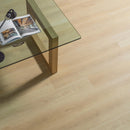 Wooden coffee table with a glass top on a wood effect luxury vinyl floor.