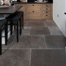 Kitchen with natural stone floor and wooden cabinets
