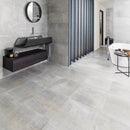 Modern bathroom with grey wall and floor tiles.