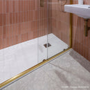 Shower with apricot metro tiles on wall and terrazzo effect floor tiles
