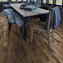 Dining area with wooden table and chairs on a wooden floor