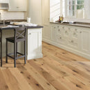 Kitchen with wooden floor and white cabinets.