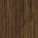Brown wood plank flooring with a distressed finish, showing natural grain, knots, and varied tones from medium to dark brown.