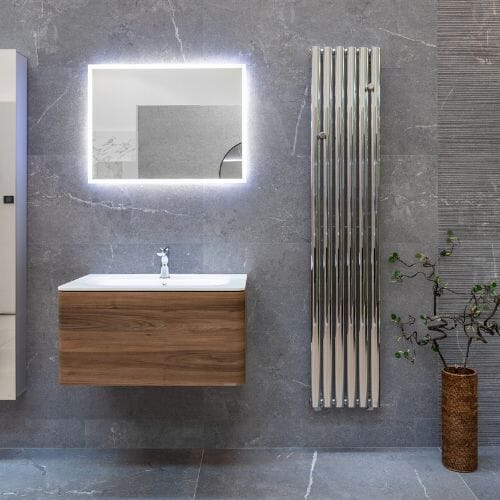 Wooden vanity unit and grey bathroom tiles.
