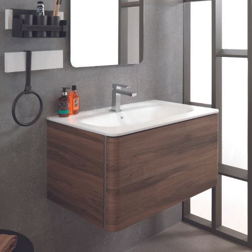 Chrome tap, wooden vanity unit and matt white basin.