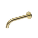 Brass wall-mounted tap on a white background