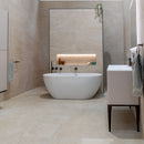 Modern bathroom with a freestanding bathtub and vanity unit.