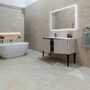 Modern bathroom with a freestanding bathtub and vanity unit and illuminated mirror.