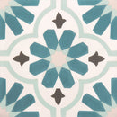 Decorative tile with geometric pattern in teal, gray, and white